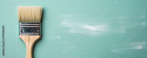 Paintbrush on an empty cyan background, with copy space for photo text or product, blank empty copyspace