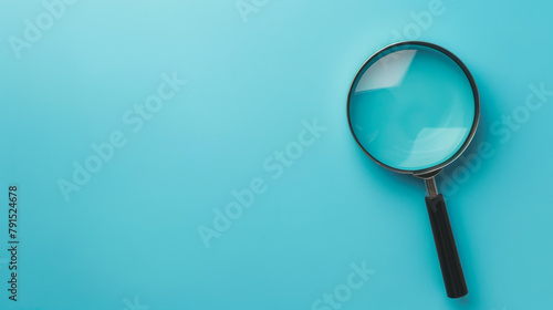 magnifying Glass on clean empty blue background