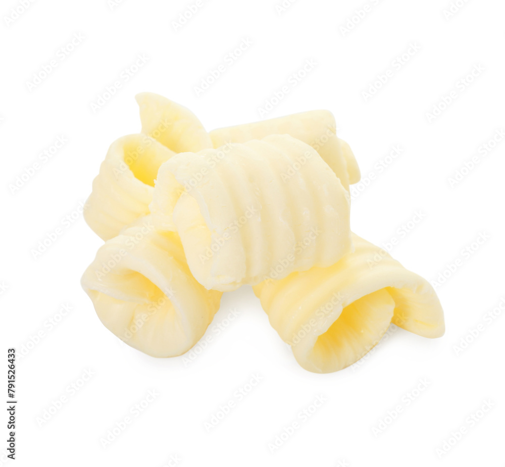Pile of tasty butter curls isolated on white Pile of tasty butter curls isolated on white