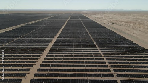 Aerial footage of the solar panels rows on a sunny day in Atacama Desert in Tarapaca, Chile photo