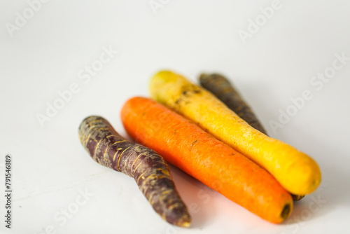 Ancient carrot purple and yellow on a white background,