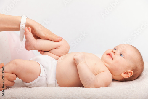 Physiotherapist performing infant development exercise