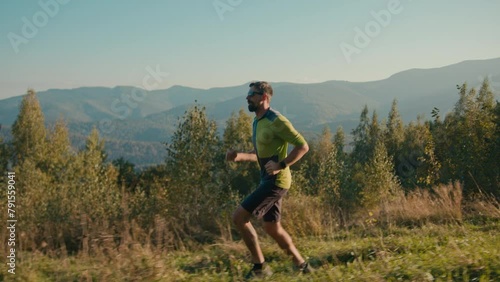 Side view fitness Caucasian male man guy running active cardio sport exercise trail hike runner traveler exploring path athlete sportsman outside sunny wild green nature activity healthcare travelling