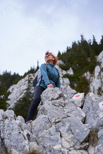 Woman mountaineer on a rocky mountain face