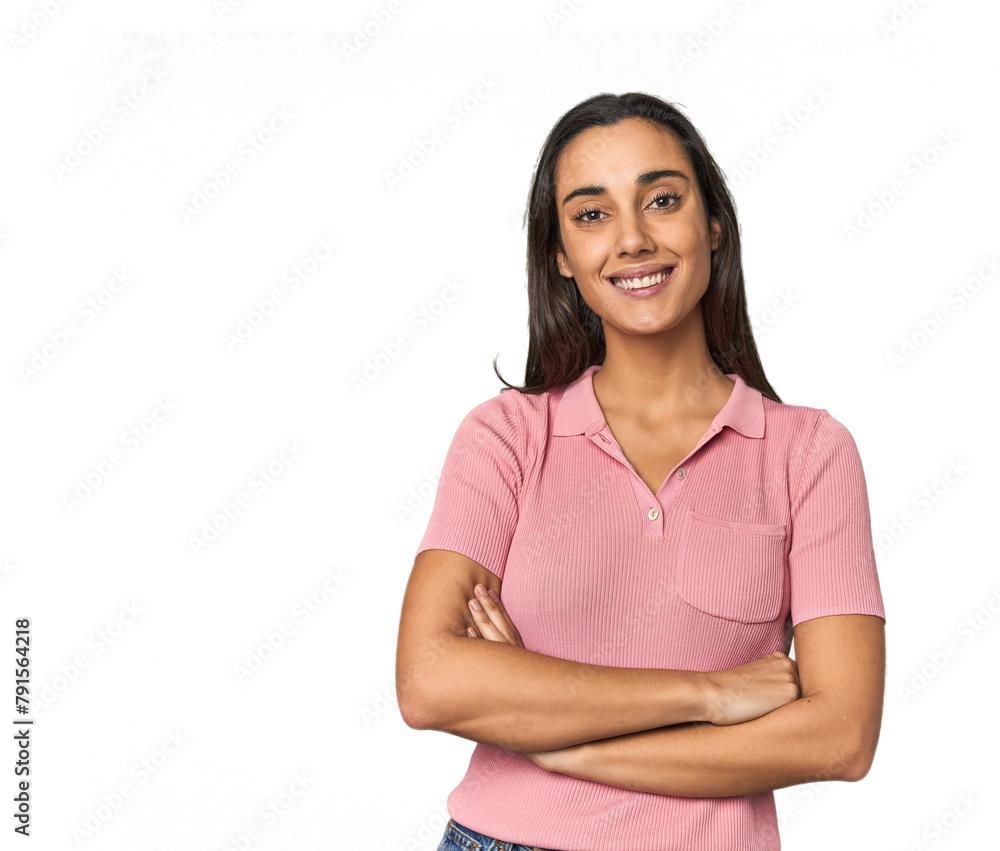 Hispanic young woman who feels confident, crossing arms with determination. Hispanic young woman who feels confident, crossing arms with determination.