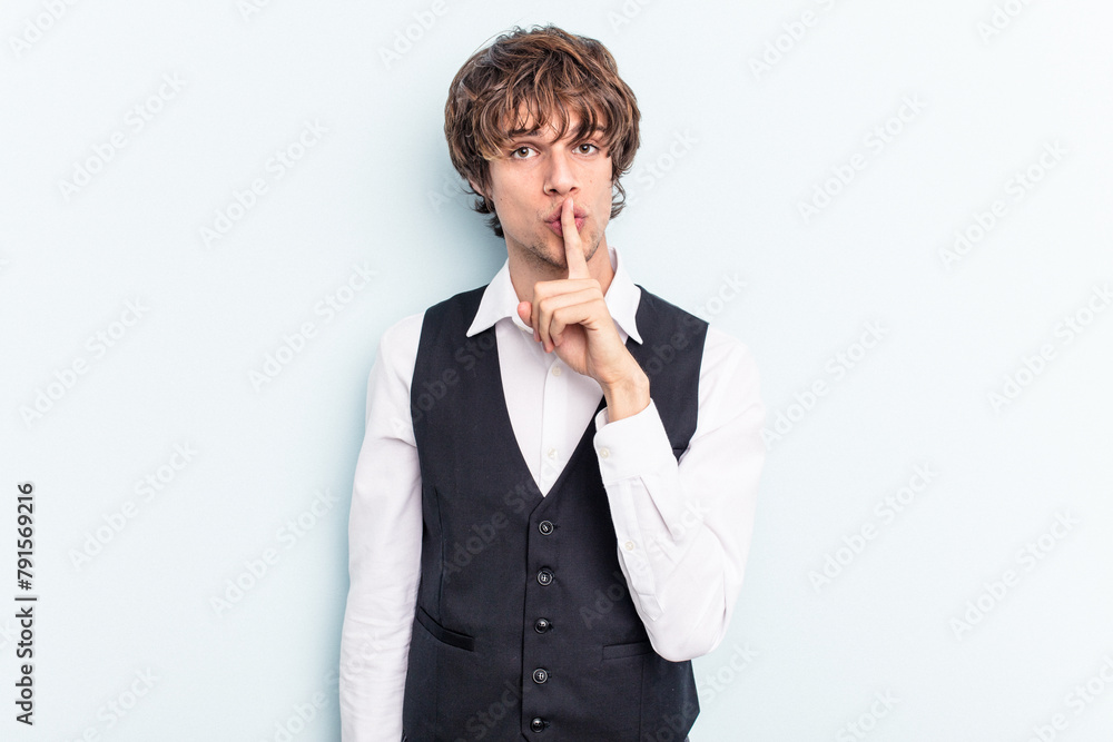 Young caucasian waitress man isolated on blue background keeping a secret or asking for silence. Young caucasian waitress man isolated on blue background keeping a secret or asking for silence.