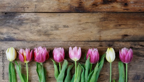 Fresh Tulips on Vintage Wooden Background: Copy Space