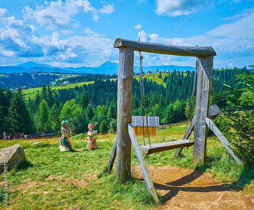 The swing against the mountains, Mountain Valley Peppers, Carpathians, Ukraine photo