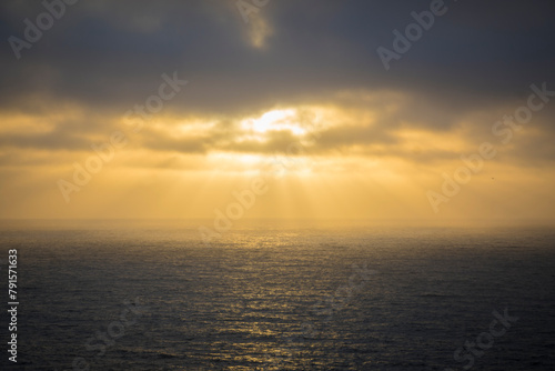 Golden Sunset Rays Over Calm Seascape