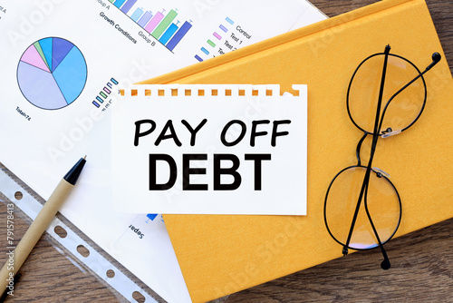 Картината върху платно pay off debt text on the page on a yellow notepad
