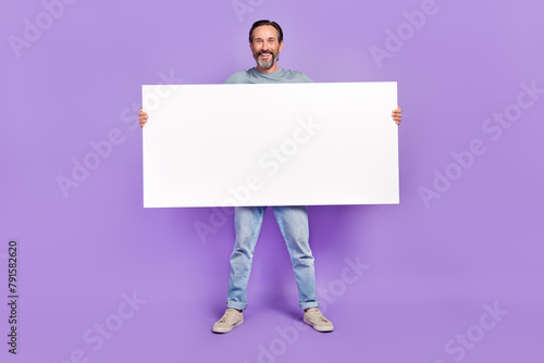 Fotografie Full body photo of aged man hold big paper white banner promotion isolated over
