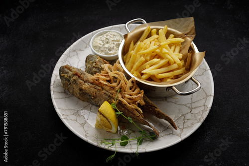 Deep Fried goby fish with fried potatoes