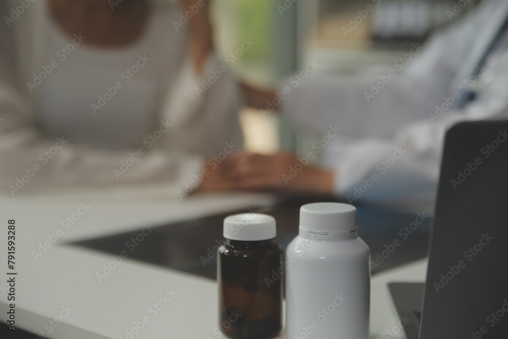 Doctor giving hope. Close up shot of young female physician leaning forward to smiling elderly lady patient holding her hand in palms. Woman caretaker in white coat supporting encouraging old person Doctor giving hope. Close up shot of young female physician leaning forward to smiling elderly lady patient holding her hand in palms. Woman caretaker in white coat supporting encouraging old person
