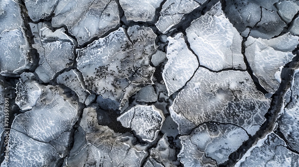 A close-up aerial view reveals the textured, dry, and cracked surface of Iceland's vast during winter A close-up aerial view reveals the textured, dry, and cracked surface of Iceland's vast during winter