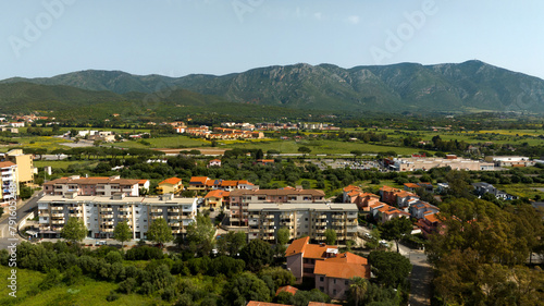 Aerial view on buildings with mountains in the background in Iglesia, southern Sardinia, Italy. photo