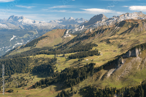 Aerial view of Swiss Alps near Fronalpstock in Stoos, Switzerland. Walking trails in mountains. Bright, sunny day.