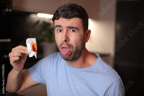 Man coughing saliva with blood