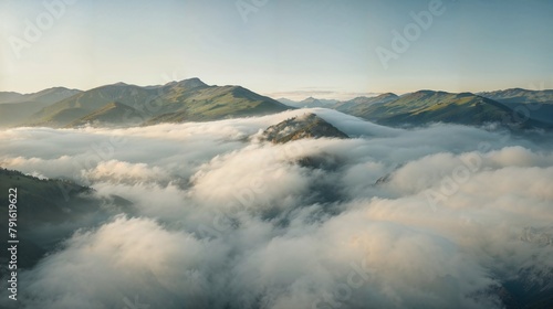 Sky engulfing a mountain, cloaked in clouds, amidst a natural landscape