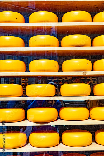yellow cheese wheel as decoration in the shop window