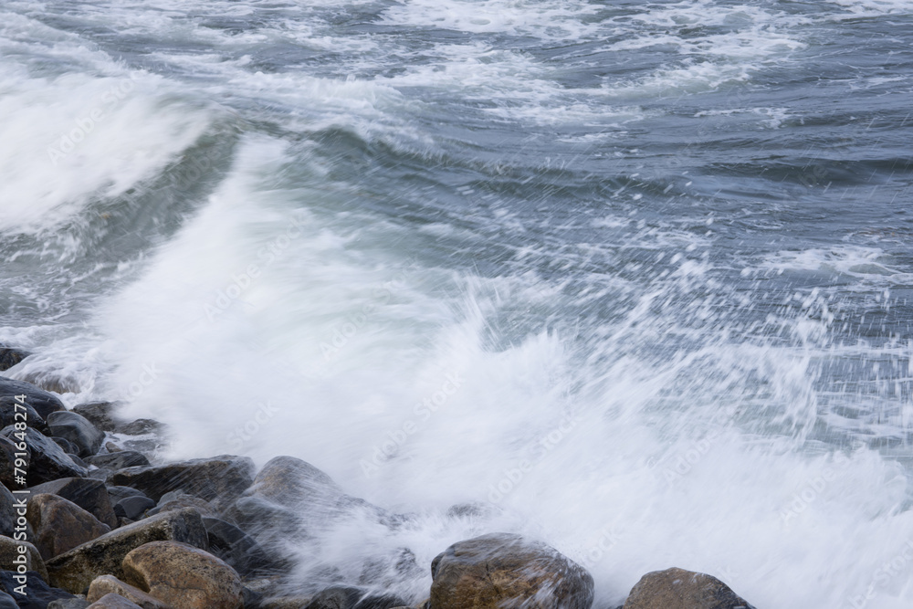 Ocean waves splashing on a rocky shore Ocean waves splashing on a rocky shore