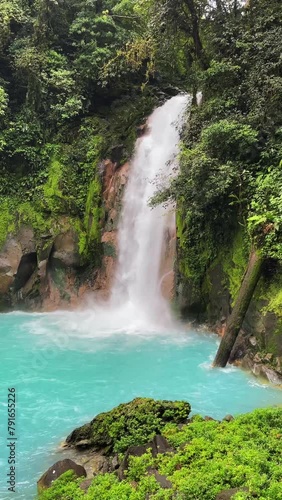 4K panoramic video of majestic Rio Celeste Waterfalls  and blue lake in Tenorio volcano and national park in Costa Rica which is a very popular tourist destination.