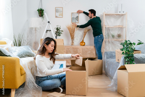 Couple organizing home during moving day.