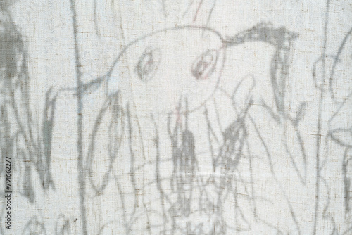 Child's crayon drawing of a dog on textured paper photo