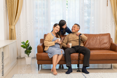 Portrait of enjoy happy love asian family senior mature father and young daughter smiling play laughing and having fun together at home, care, elderly, insurance.happy family and Father Day concept