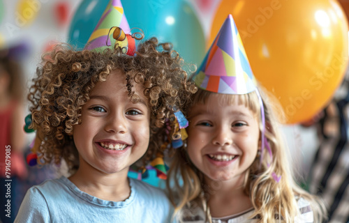 happy girls at birthday party, with balloons and cap on their heads, children's faces in focus, blurred background showing other kids playing games, bright colors of the decorations, capturing joyous