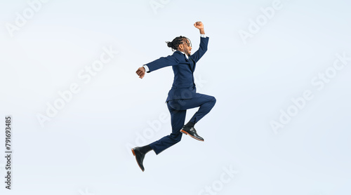 ジャンプする黒人男性ビジネスパーソンの全身写真（切り抜き背景透過PNGも販売しております。作成者リンクから「PNG」で検索してください） photo