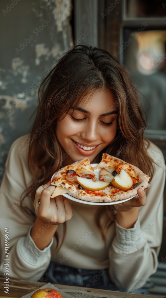 Woman Enjoying Pizza Slice at Table