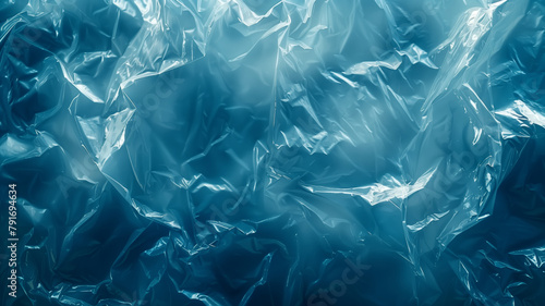 A close up view of a shiny blue plastic bag, displaying the texture and color of the cellophane material photo