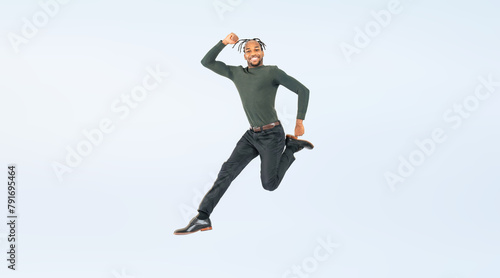 Full body photo of a black man jumping