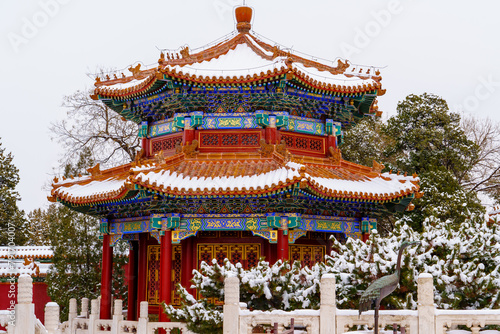 Snow scene of traditional Chinese octagonal pavilion
