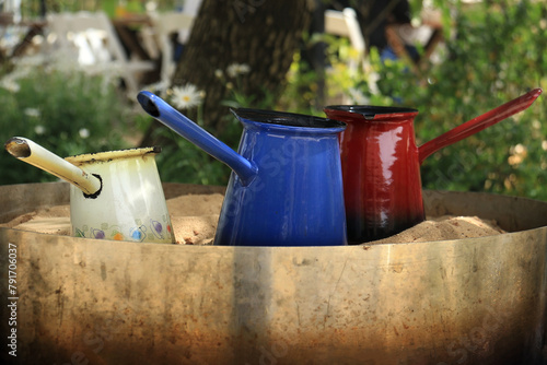 Lebanese Coffee Kettles in Sand photo