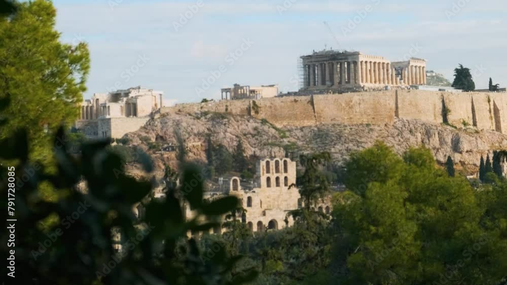 Parthenon Temple at the Acropolis of Athens in Greece on the top of hill in sunny day. Popular summer vacation travel destination in Europe. Shift focus Parthenon Temple at the Acropolis of Athens in Greece on the top of hill in sunny day. Popular summer vacation travel destination in Europe. Shift focus