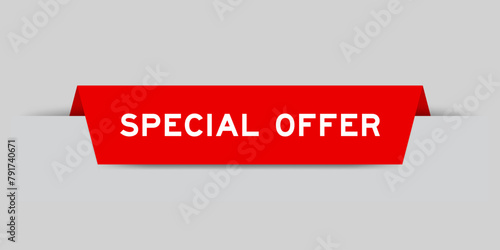 Red color inserted label with word special offer on gray background