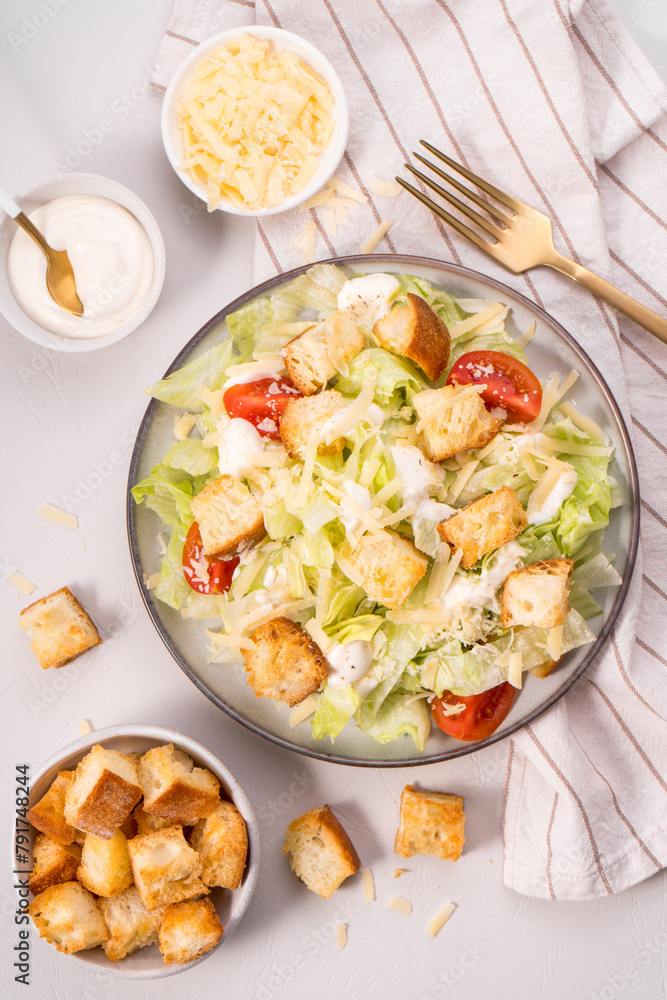 Caesar Salad with Lettuce, Cheese, Cherry Tomatoes and Croutons Caesar Salad with Lettuce, Cheese, Cherry Tomatoes and Croutons