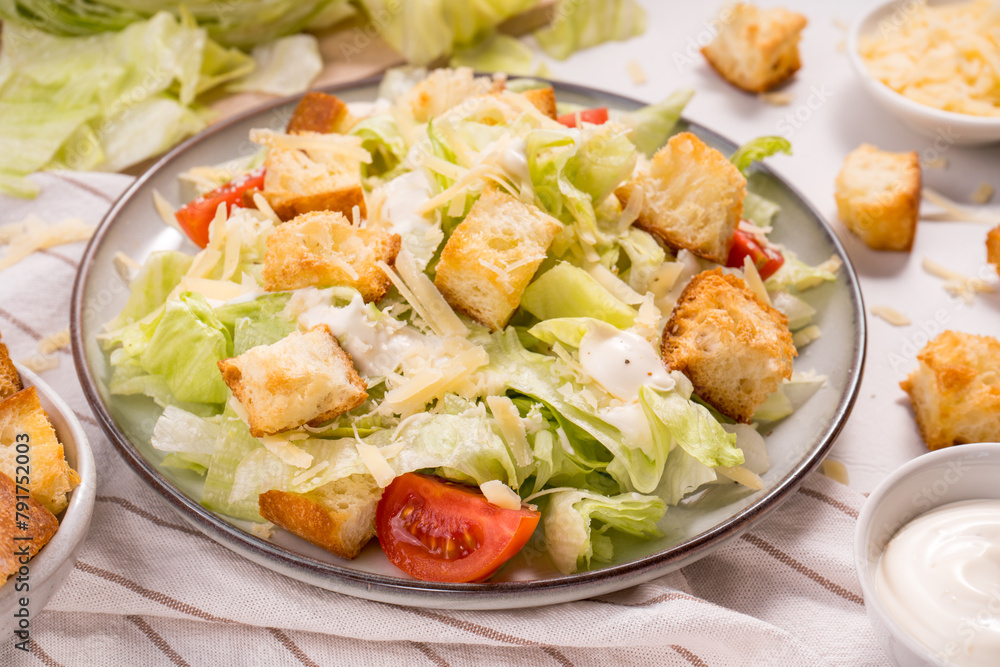 Caesar Salad with Lettuce, Cheese, Cherry Tomatoes and Croutons Caesar Salad with Lettuce, Cheese, Cherry Tomatoes and Croutons
