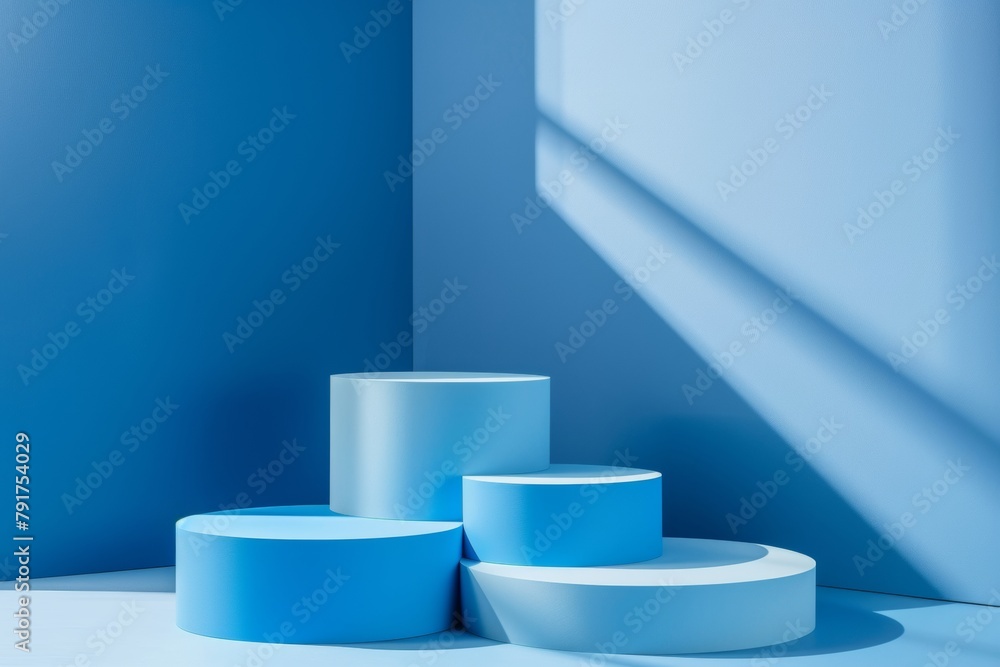 Four Blue Product Display Podiums With Different Heights For Product Presentation On a Minimalist Blue Background Four Blue Product Display Podiums With Different Heights For Product Presentation On a Minimalist Blue Background
