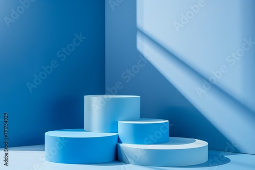 Four Blue Product Display Podiums With Different Heights For Product Presentation On a Minimalist Blue Background