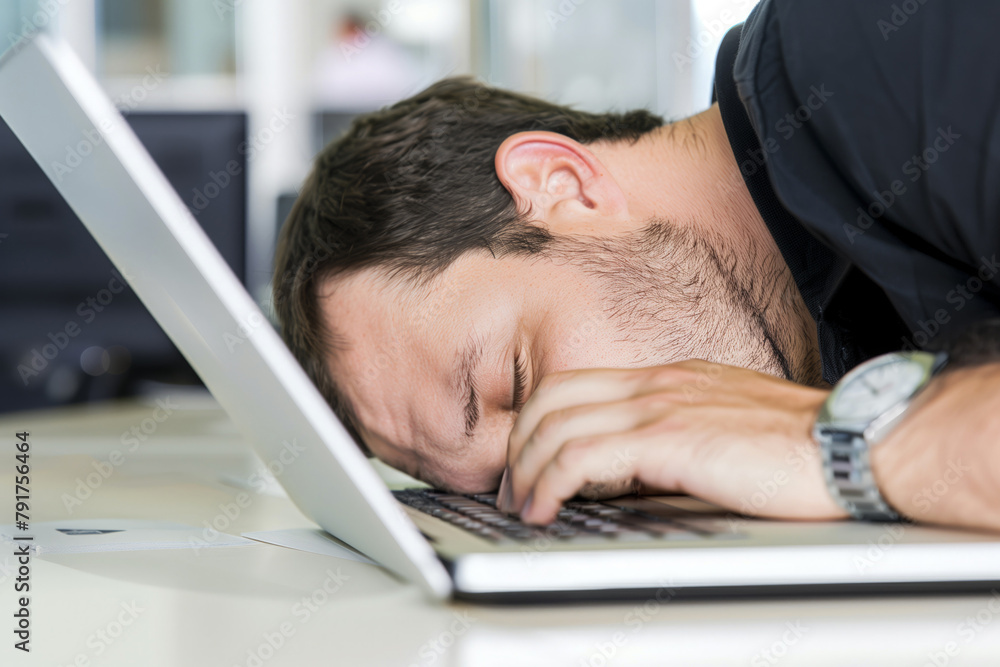 Overworked businessman naps at office desk Overworked businessman naps at office desk