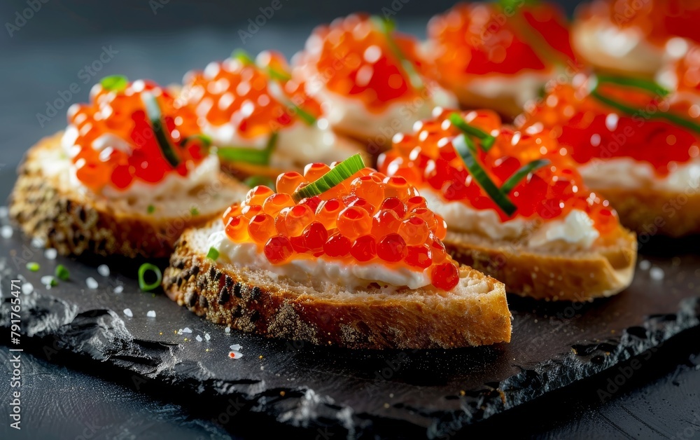 Delectable caviar-topped canapes made with crusty bread, a creamy spread, and glistening orange fish roe, garnished with fresh herbs for an elegant appetizer. Delectable caviar-topped canapes made with crusty bread, a creamy spread, and glistening orange fish roe, garnished with fresh herbs for an elegant appetizer.