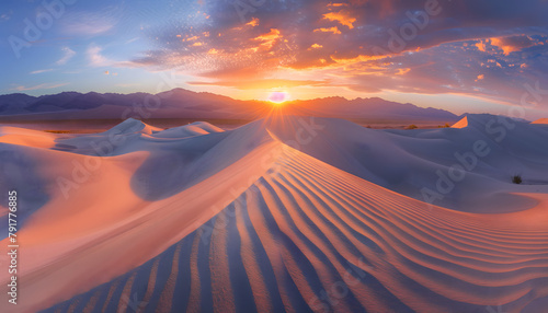 Sun rising over the horizion, casting light over the seamlessly neverending pristine sand dunes  photo