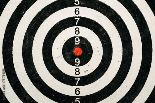 Dartboard target with red dot center close up