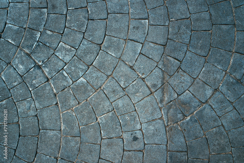 Cobblestone pattern of the sidewalk pavement from above as background and urban street texture © Bits and Splits