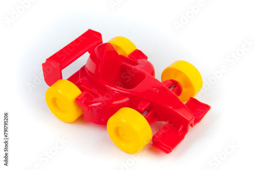 toy motor racing car, for children's fun and play, front closeup view, isolated on white background. For the development of the child.