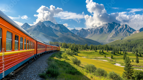 A brightly colored train rides on rails through the picturesque landscapes of mountains and fields
