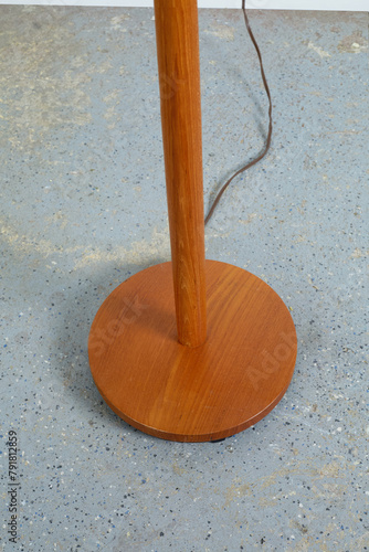Beautiful vintage solid wood floor lamp. Interior product photograph, close-up of the base.