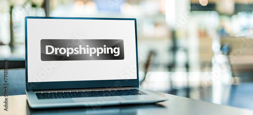 Laptop computer displaying the sign of Drop shipping